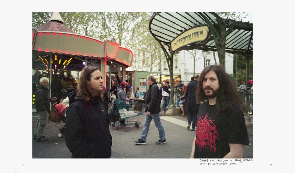 Two Men in Front of a Ferris Wheel in Paris