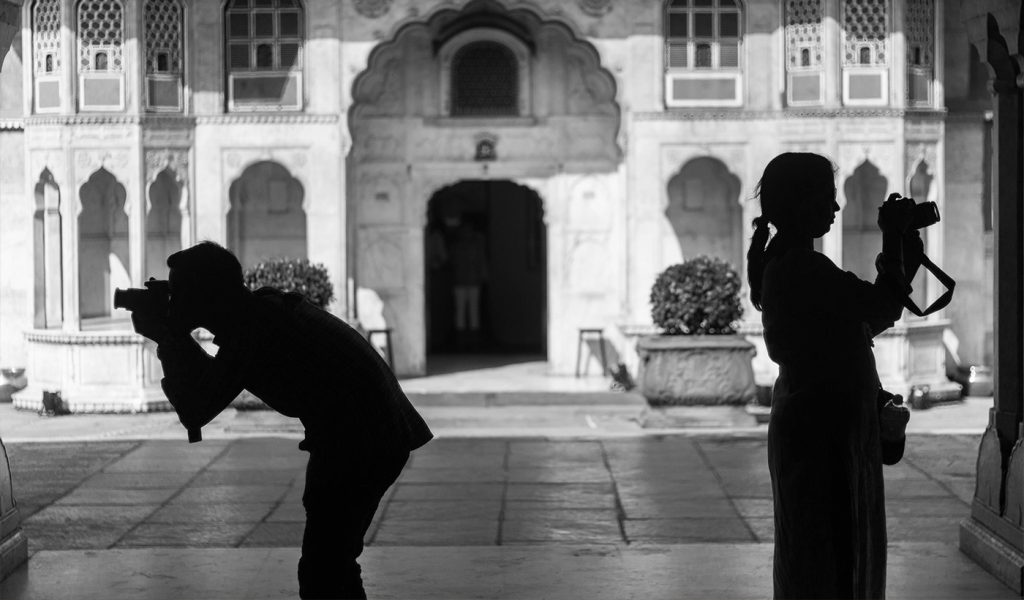 Black and white photography of two photographers taking pictures on opposite sides